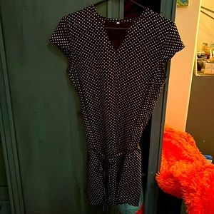 Navy blue, thigh length dress with white polka dots. Business casual.